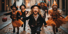Children Have Fun In The Street During Halloween Party