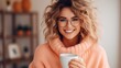 © sirisakboakaew - Enjoying a cup of coffee at home. Smiling. A beautiful girl drinks hot tea in winter. Excited woman wearing glasses and a sweater and laughing on an autumn day