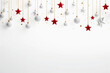 White baubles plus red and white stars hanging down over a white background with copy space underneath,
