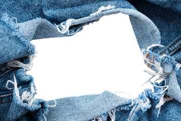 hole in denim on a white background. ripped jeans