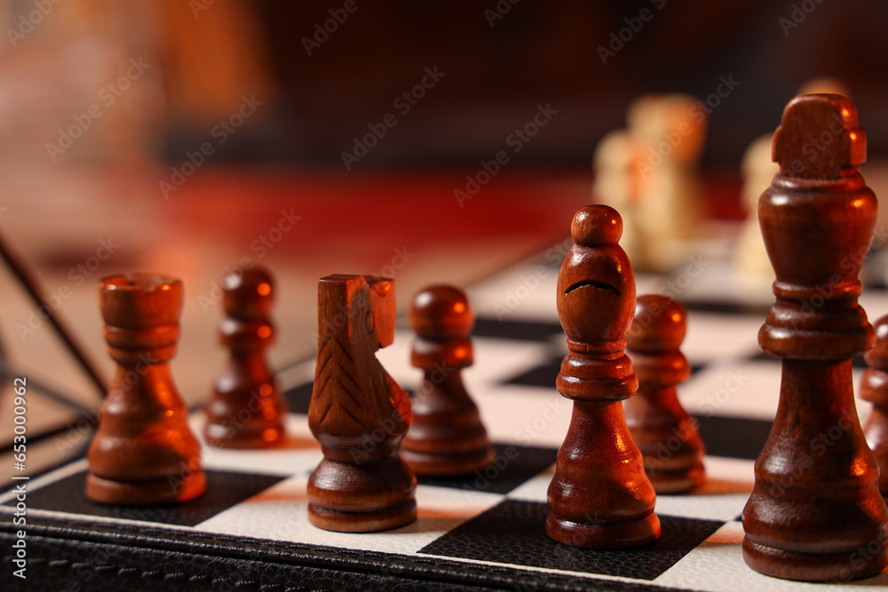 Chess pieces on game board, closeup