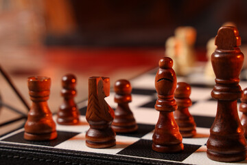 Wall Mural - Chess pieces on game board, closeup