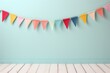 Colorful holiday flags in the form of a garland on the wall. Congratulatory background with place for text. Holiday concept