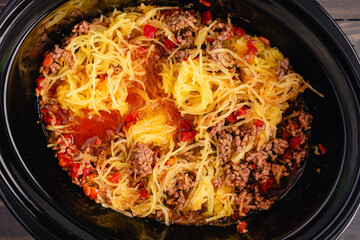 Wall Mural - Spaghetti Squash Bolognese in a Slow Cooker: Spaghetti squash mixed with a ground beef and tomato sauce in a crockpot