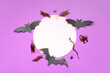 Leinwandbild Motiv Halloween composition with blank card, bats and candy bugs on purple background