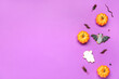 Leinwandbild Motiv Halloween composition with candy bugs and pumpkins on purple background