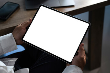 Poster - Digital tablet computer close up man using tablet hands man multitasking with isolated screen
