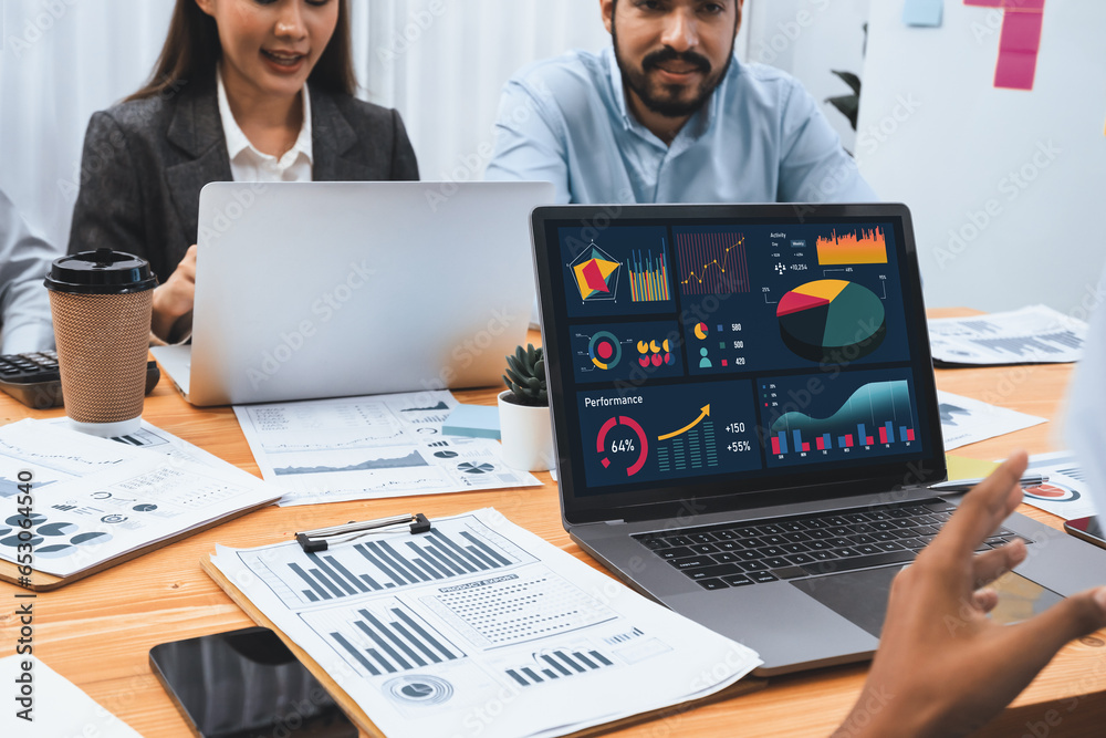 Multiracial analyst team use BI Fintech software to analyze financial ...