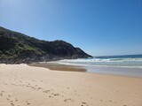 Fototapeta Do akwarium - Rocks and cliff on the sandy Boomerang Beach New South Wales Mid-North Coast Australia