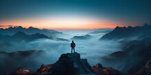 A Mountain Climber Standing On Top Of A Mountain Looking At The Horizon On A Snowy Landscape At Sunset . Mountain Climber Conquering The Summit At Sunset