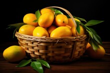 Ripe Mangoes In A Basket On A Wooden Table, A Basket Full Of Ripe Mangoes With Green Leaves, Fresh Yellow Mangoes, Organic Juicy Sweet Fruits, Summer Fruits
