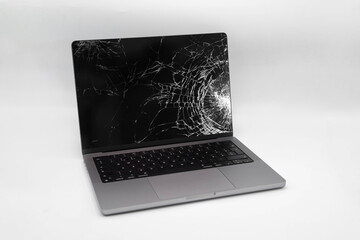 Wall Mural - Broken LCD display on laptop computer. Isolated white background.