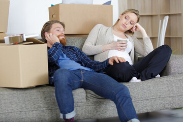 beautiful young couple looking tired and bored