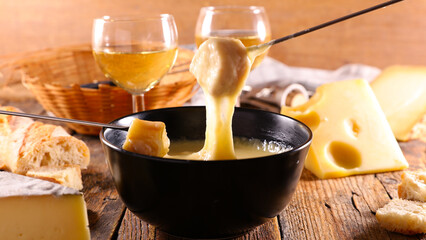 Wall Mural - cheese fondue, bread and white wine glasses