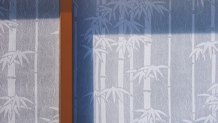 Wall Mural - White mulberry paper sunshade curtain with bamboo tree pattern behind glass sliding wall inside of vintage room with sunlight and shadow on surface