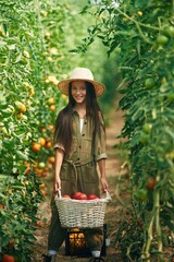 Poster - Standing and posing, holding tomatoes. Little girl is in the garden