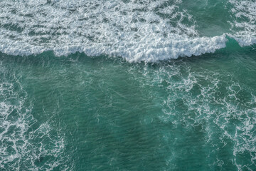 Wall Mural - ocean foamy pattern on water surface. top view.