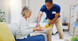 © Wesley JvR/peopleimages.com - Breakfast, assisted living and retirement with a old woman on a sofa in the living room of her home. Morning, food and a nurse black man serving a meal to an elderly patient in a care facility