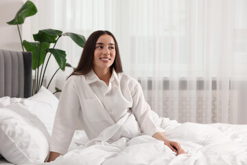 Canvas Print - Happy woman in bed at home, space for text. Lazy morning