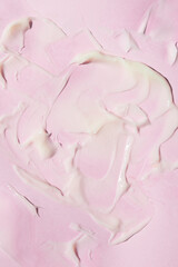 Wall Mural - Creamy texture on a pink background, abstract image