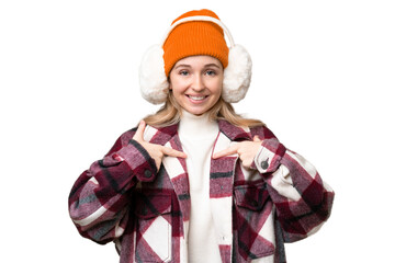 Sticker - Young  English woman wearing winter muffs over isolated background with surprise facial expression