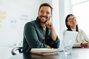 Poster - Business man listening to a discussion during a meeting