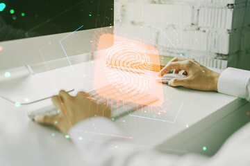 Aufkleber - Double exposure of abstract creative fingerprint hologram with hands typing on laptop on background, research and development concept