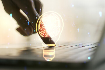 Poster - Double exposure of creative light bulb hologram with human brain and with hands typing on laptop on background, idea and brainstorming concept