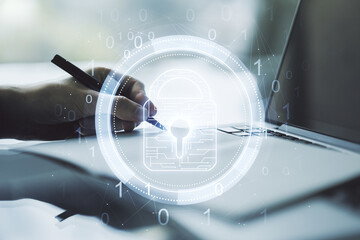 Aufkleber - Double exposure of creative lock hologram with chip and hand writing in notebook on background with laptop. Information security concept
