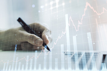 Aufkleber - Abstract creative financial graph with hand writing in notebook on background, forex and investment concept. Multiexposure