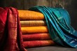 beautifully folded sarees in various colors and patterns