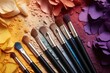 makeup brushes against a color palette swatch