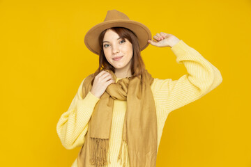 A stylish girl in a hat and scarf