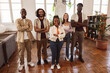 © PintoArt - group of young multiracial creative people from a modern company, standing together with arms crossed