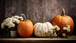Autumn pumpkins and flowers in the rustic style