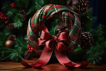 Red And Green Plaid Ribbon Twirled In Pine Wreath