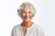 An older woman with white hair smiling at the camera. Suitable for lifestyle, senior living, and positive aging concepts.