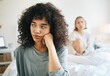 © aLListar/peopleimages.com - Lgbtq, woman and frustrated for couple fight in bedroom of home with conflict, crisis or problem in relationship. Lesbian, partner and girl on bed with stress, anxiety and depressed for argument