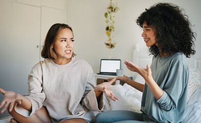 Wall Mural - Lgbtq, women and couple argue in bedroom of home with conflict, crisis or problem in relationship. Lesbian, partner and girl on bed with stress, anxiety and depressed for argument, divorce or fear