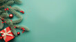 Top view of composition with Christmas decorations and copy space on green background. New Year winter banner.