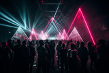 Fototapeta  - Crowd watching a laser show at a nightclub. People participating in music event with lasers.