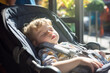 Adorable baby boy sleeping in a stroller in cafe or restaurant on sunny day. Going out with small children.