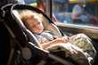 Adorable baby boy sleeping in a stroller in cafe or restaurant on sunny day. Going out with small children.