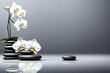 Spa stones and white orchid on the grey background free space