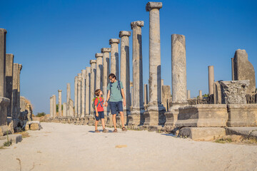 Wall Mural - dad and son tourists at the ruins of ancient city of Perge near Antalya Turkey. Traveling with kids concept