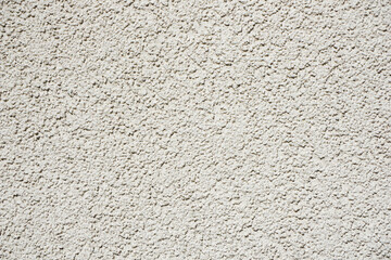 Wall Mural - Stucco wall texture. White concrete surface background. Beige plaster wall pattern. Distressed noise backdrop for graphic design. Rough noise background. Small stones pattern. Grain texture.