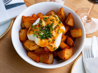 Delicious spanish patatas bravas tapas, fried pieces of potatoes