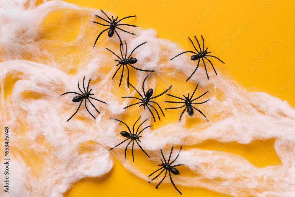 Cobweb with spiders for Halloween party on orange background