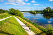 © Taljat - Chatilllon sur Loire, France - August 9, 2023: Cyclists ride on thefra cycle path along the Loire River in France.