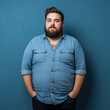 © PaulShlykov - Excited fat man celebrating success. Happy plus size bearded man on blue background